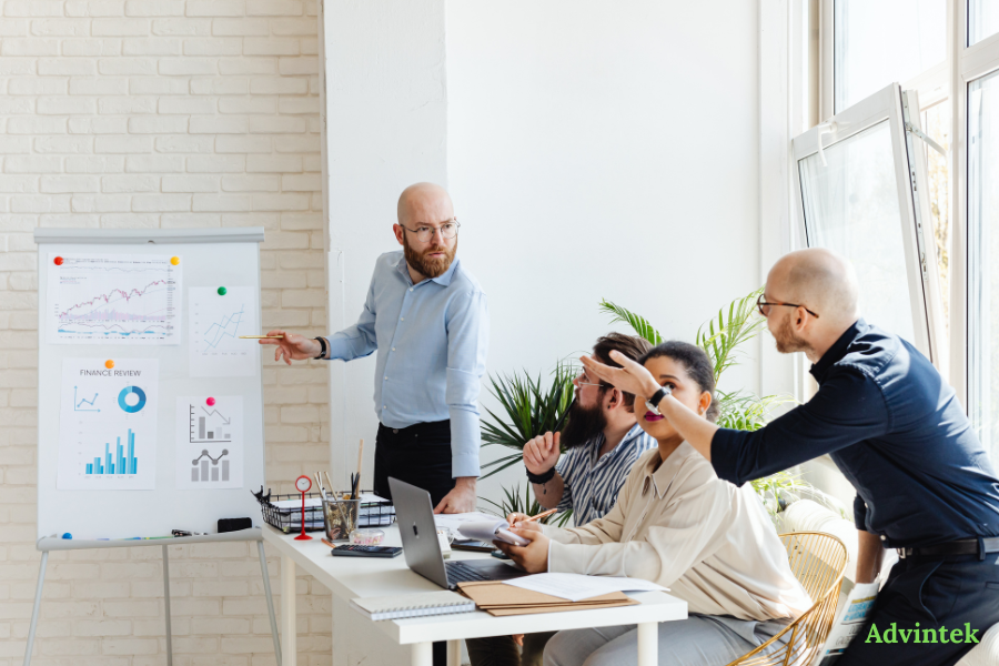 UAE e-Invoicing Guide: PEPPOL Framework, Requirements & Compliance Timeline (2026–2027) 2 Finance professionals discussing PEPPOL e-invoicing UAE requirements and compliance implementation strategy