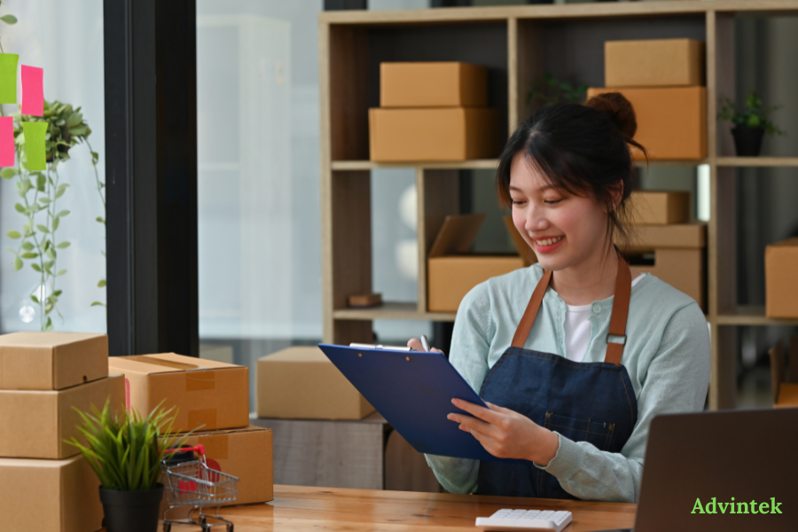 UAE E-Invoicing for SMEs: A No-Jargon Guide to Complying Before July 2027 2 Small business owner reviewing order records for UAE e-invoicing compliance
