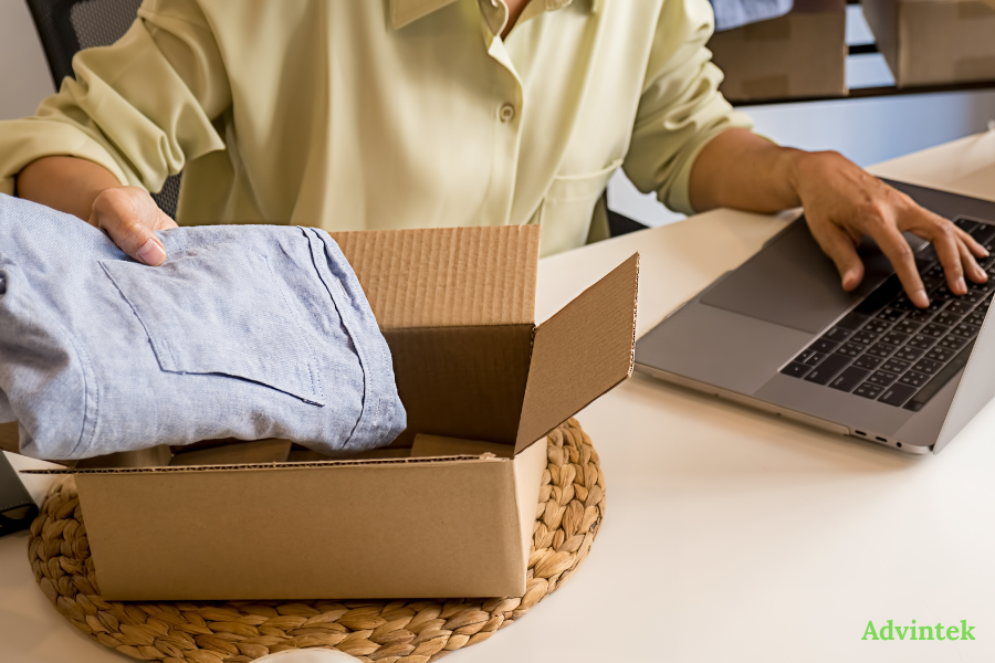 UAE E-Invoicing for SMEs: A No-Jargon Guide to Complying Before July 2027 3 SME packing online orders while managing UAE e-invoicing records on laptop