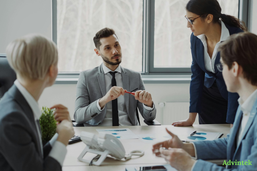 UAE E-Invoicing for Odoo: Step-by-Step Setup and ASP Integration Guide 2 Finance team discussing e-invoicing compliance and ERP integration strategy