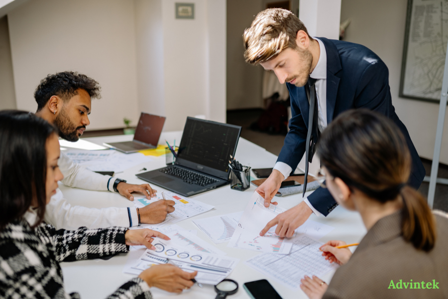 Peppol Access Points vs UAE Accredited Service Providers: What’s the Difference? 3 Business team reviewing ERP reports and invoice data for UAE e-invoicing provider selection