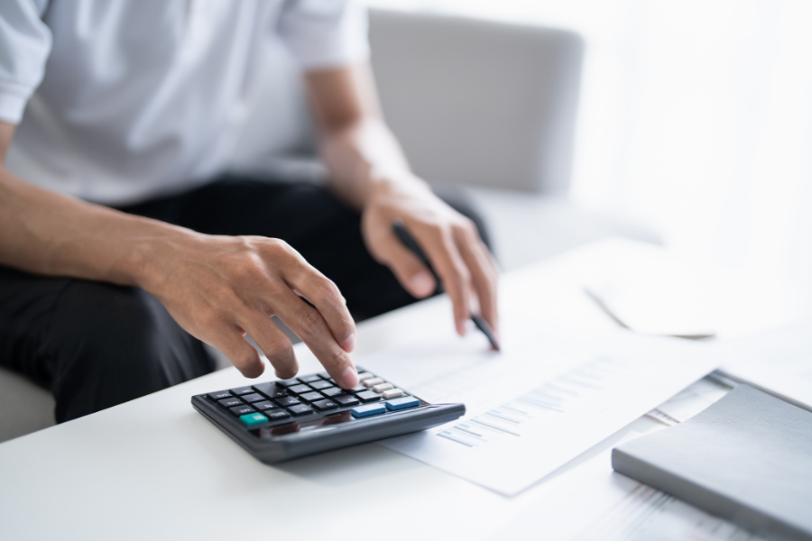 Version 1.1 Guidelines Explained: What Changed for Retention Billing, Advance Payments and Storage 2 Finance professional calculating invoice figures and reviewing business documents
